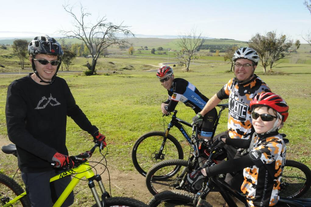 SCENIC BACKDROP: Ryan Walters, Dan Watson, Phil Egan and his son Sam overlook the stunning mountain bike track on the Vale Road which will play host to tomorrow’s big Evocities MTB Series event. Photo: CHRIS SEABROOK 052415cmtbiks5
