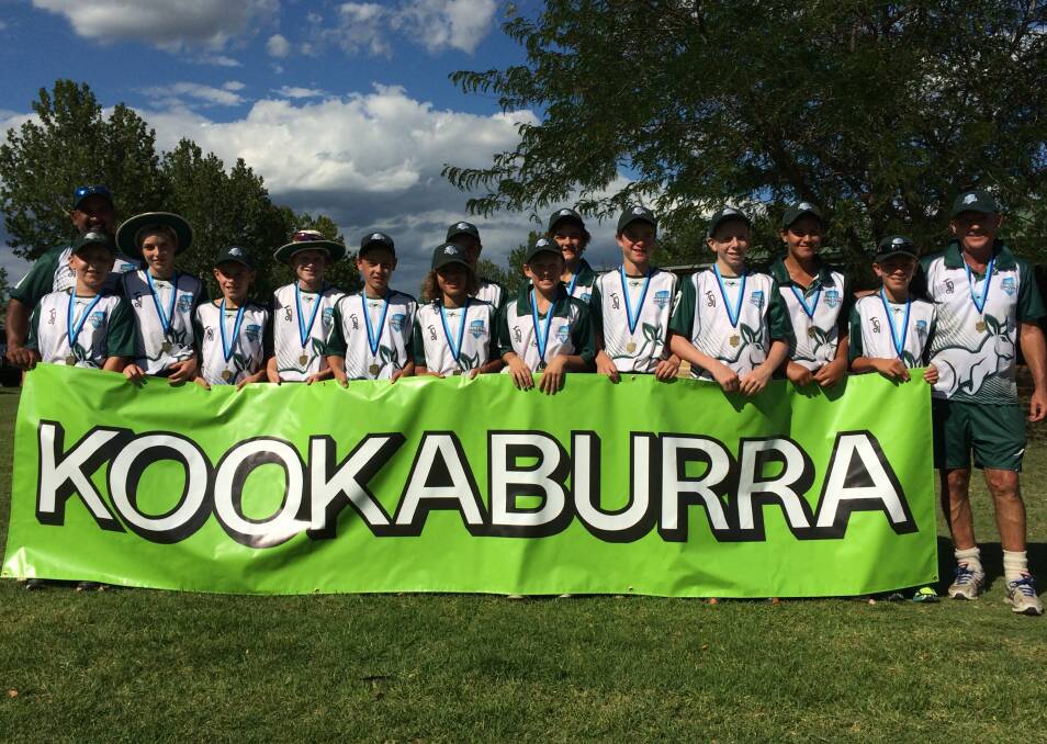 WELL PLAYED: The Western Riverina Kangaroos under 13s team with coach Garth Dean after their win in the State Challenge in Dubbo last week. 012915kangaroos