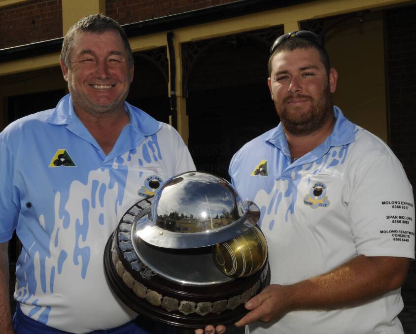 BACK FOR MORE: Bernie Diduszko (left) and Glen Miller, along with team-mate Mick Wright, took out last year’s ANZAC Triples and will be lining up to try and defend their title at this weekend’s 49th running of the tournament. Photo: PHILL MURRAY 042113ptriples