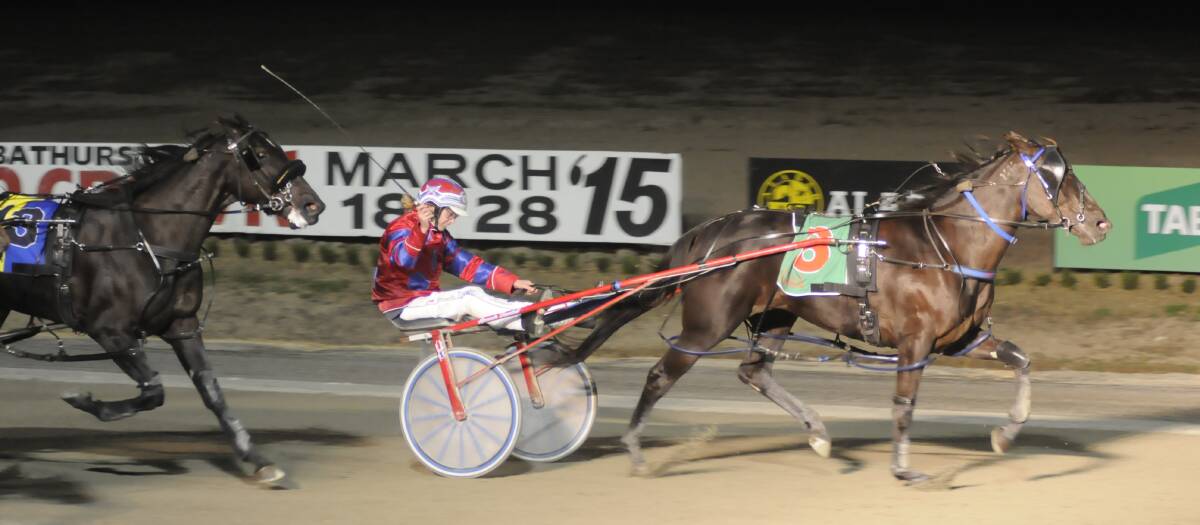 WHAT A MOMENT: Amanda Turnbull has a smile on her face as she guides Pixies Parlour to victory in the Gold Tiara Final on Saturday night. Photo: CHRIS SEABROOK 032815ctiara1