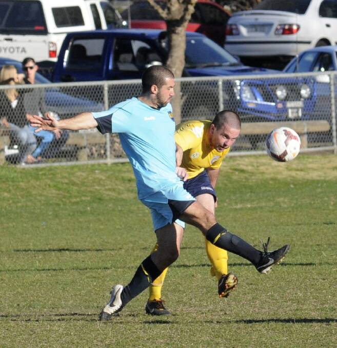SOLID: Mariners’ Ricky Guihot (right) was impressive in the season-opening win over Hawkesbury City SC. Photo: CHRIS SEABROOK 082414cmarinm1