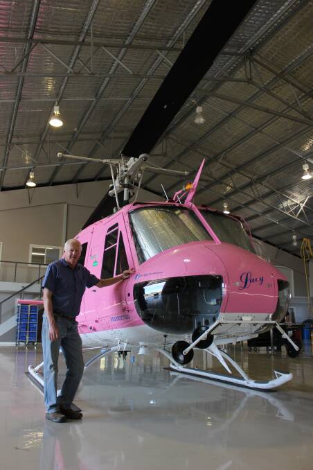 Mudgee Aero Club president Gary Chapman with Fleet Helicopters’ Lucy, which will be on display at the Wings, Wheels and Wine air show. Lucy can fly at 240 kilometres per hour and lift 14,000 litres of water.