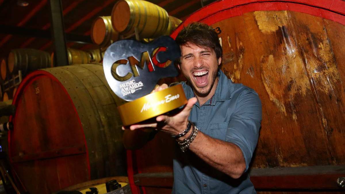 Morgan Evans, winner of the CMC Male Artist of the year, OZ Artist of the year and Australian Video of the year, with his trophy on Friday night. – The Newcastle Herald
