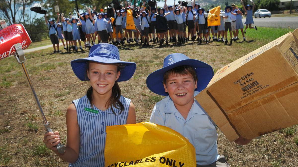 RUBBISH WARRIORS: St Edward’s pupils Jorja Ellicott and Bailey Rock were part of the clean-up of Scott Rd this week. Photo: Geoff O’Neill 110314GOA01 – The Northern Daily Leader