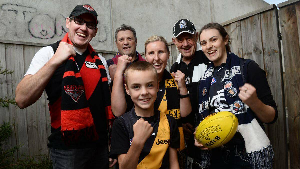 Go team: AFL fans, from left, Leon Underwood, Rodney Owen, Nelson Bawden, Shannon Bawden, Warren Heal and Sarah McGaffin are excited about the start of the season. PIcture: ADAM TRAFFORD – The Ballarat Courier