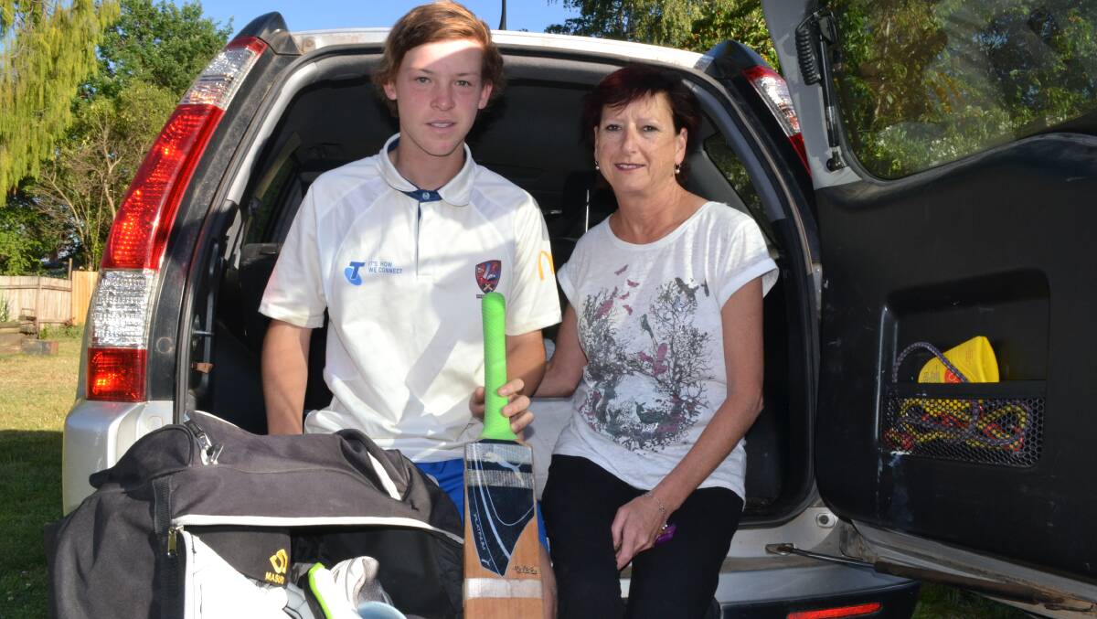 RISING STAR: Ryan Peacock, 15, with mum Fiona getting ready to hit the road for another cricket fixture. Ryan is hoping Bathurst gets the nod for a centre of excellence indoor cricket academy that could help him develop his game. Photo: BRIAN WOOD	 111314indoor 1-3