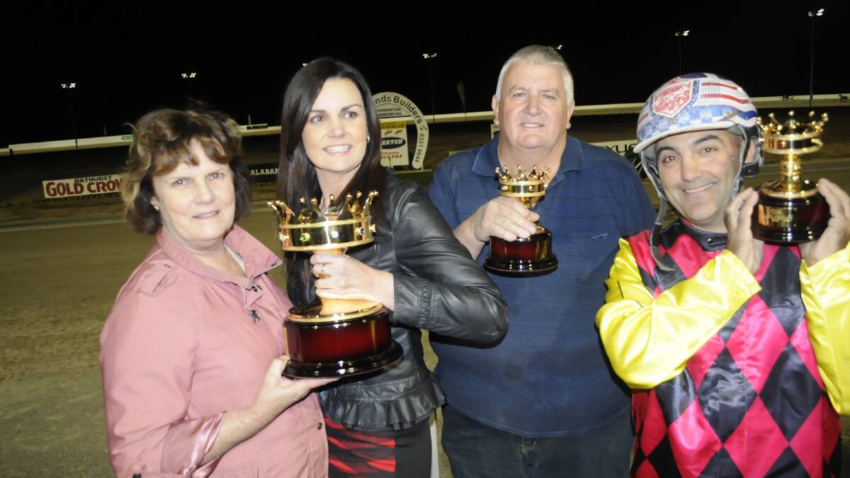 HAPPY BUNCH: Michele, Marissa and Sam Dimarco with driver Michael Formosa after 
winning Saturday night’s Gold Crown Final. Photo: CHRIS SEABROOK 	032815crown8