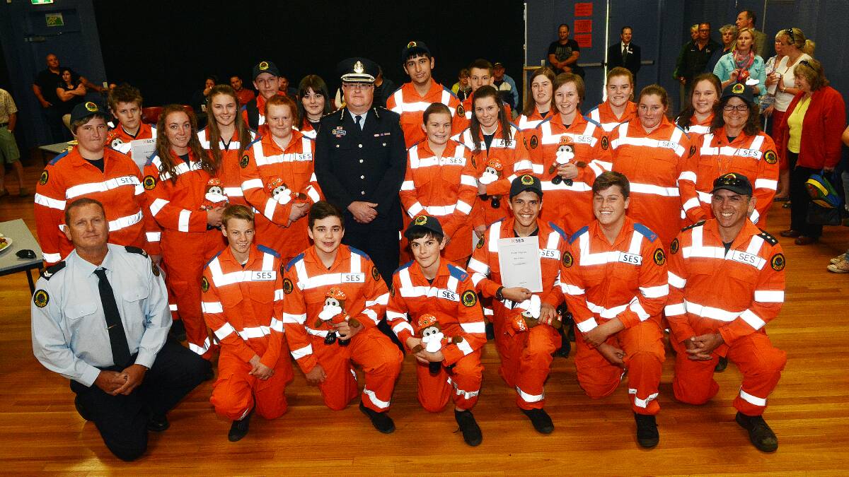 ALL SMILES: SES cadet trainer Shane Bullock and region controller Craig Ronan with Kelso High School’s newly graduated cadets.