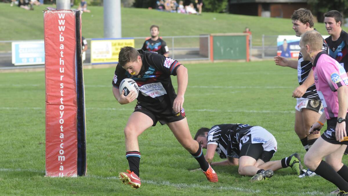 OVER HE GOES: Mick Ingwersen seals the deal for the Bathurst Panthers with the final try in his side's 32-24 win over the Cowra Magpies. Photo: CHRIS SEABROOK
