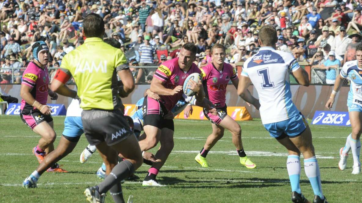 PANTHERS DEAL: The Penrith Panthers in action against the Gold Coast Titans at last year's NRL clash at Carrington Park.