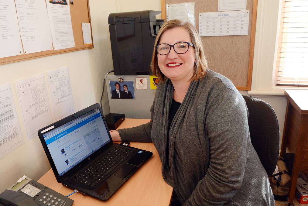 SCHOOL DEALS GO ONLINE: The Scots School enrolments and promotions officer Lynda Ireland checking out the online discounts now on offer for vacant places at the school through the School Places website. Photo: PHILL MURRAY 072914pscots