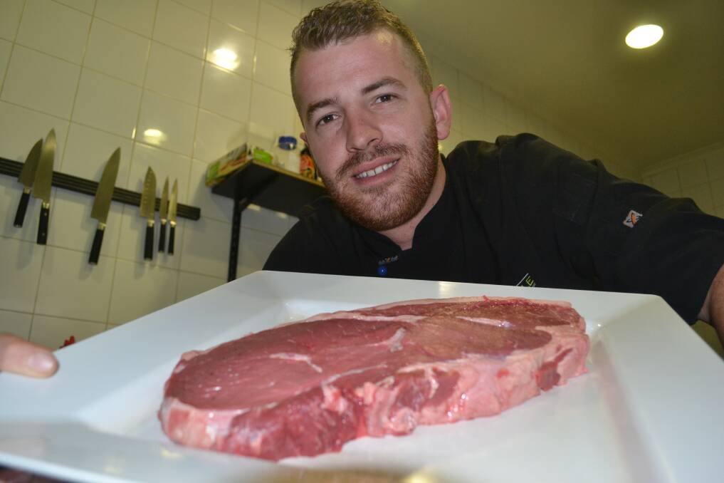 KINGS KILO: Stuart Peel from The Kings Table with a massive Kings Kilo rump steak. His restaurant in The Kings Hotel is one of two local pubs make the top 10 finalists in the AHA NSW battle for the best steak. Photo: BRIAN WOOD 	112515steak