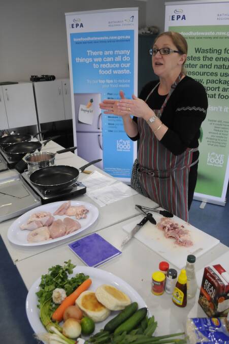 LOVE FOOD HATE WASTE: MasterChef winner from 2011 Kate Bracks made four dishes from one chicken at Kelso Community Centre during her demonstration. Photo: CHRIS SEABROOK 072215cbracks