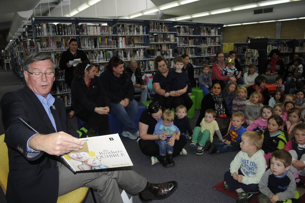 STORY TIME: Mayor Gary Rush was the guest storyteller at the Bathurst City Library on Wednesday morning for the National Simultaneous Storytime campaign occurring across Australia at 11am. Photo: CHRIS SEABROOK 052715cstory