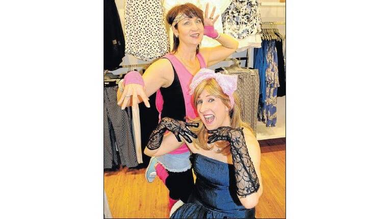 CRAZY TIMES: Sue MacKay and Elena Howe, from Sussan, are pictured dressed up in their 1980s outfits and are among the retailers excited about tomorrow's Crazy Day.