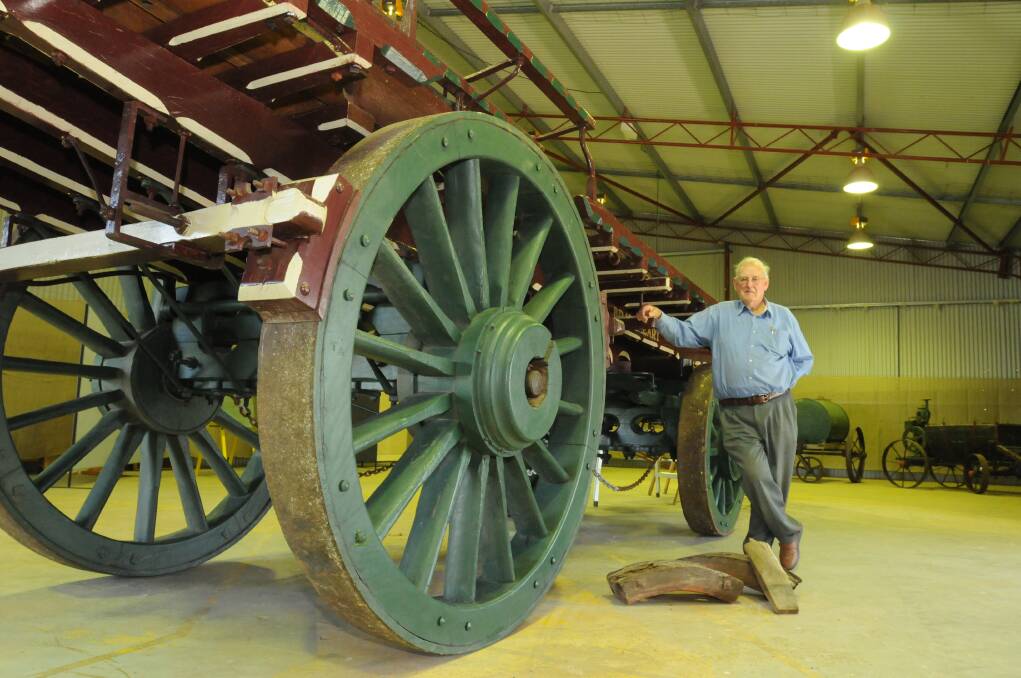 GOOD AS NEW: Viv McMillan, pictured with a 1900s Braveheart wagon he restored. It will be among the attractions when the Australian National Field Days open today. Photo: JUDE KEOGH	1020fielddays2