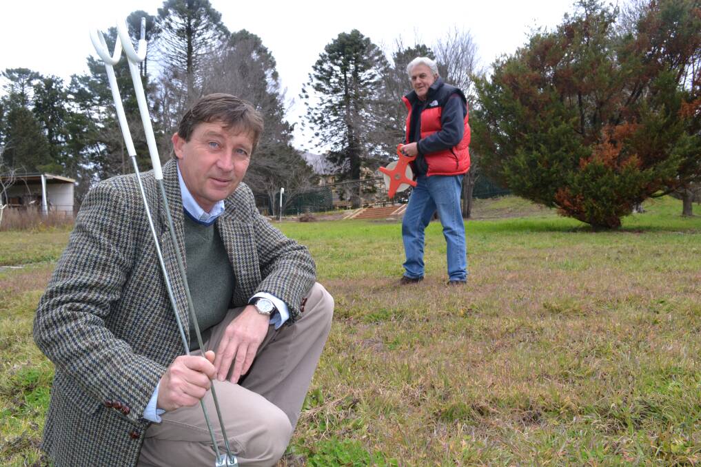 NEW VENTURE: Christopher Morgan from Abercrombie House, left, and local vigneron Tony Hatch from Vale Creek Wines marking out where vines are to be planted as part of a new venture at the historic mansion on the Ophir Road. Photo: BRIAN WOOD 071614morgan1