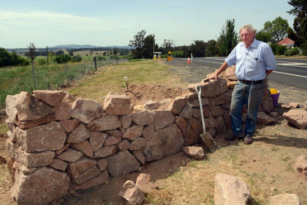 STONE WALLED: David McKibbon believes the erection of a dry stone wall on the O’Connell Road will one day cause a serious accident as it impedes motorists’ line of sight on that busy stretch of roadway on the outskirts of the village. Photo: PHILL MURRAY 110514pwall