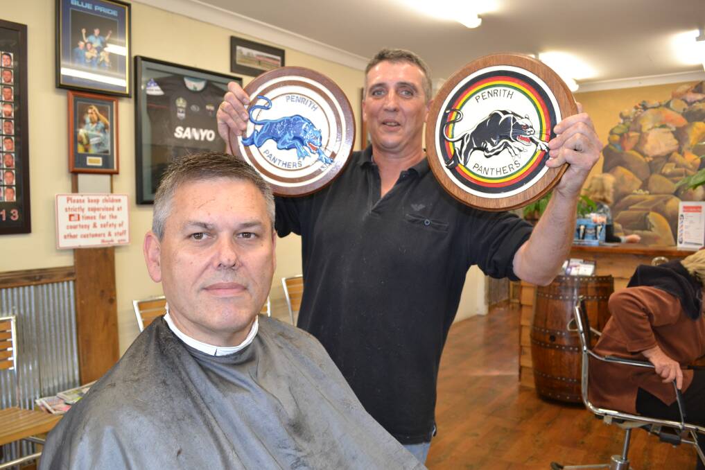 GO THE PANTHERS: Dave Melrose is a born and bred Panthers fan who wouldn't miss the big NRL match at Carrington Park against the Cronulla Sharks for the world. Customer Steve Woodhouse is also a Penrith supporter. Photo: BRIAN WOOD 060614dave1