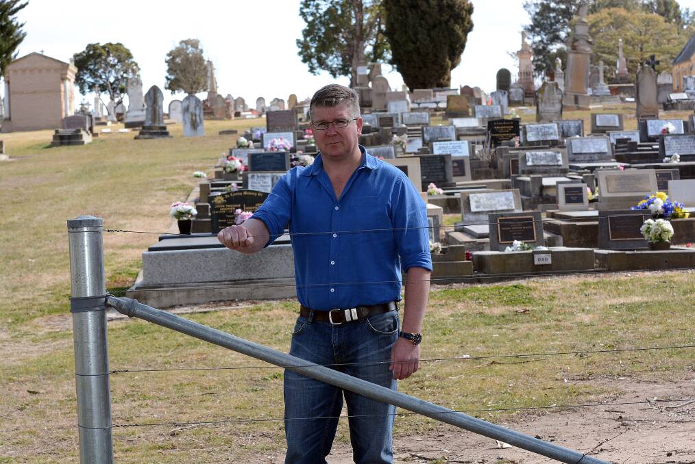 LOCK OUT: Bathurst councillor Michael Coote wants to see historic sections of Bathurst Cemetery fenced off to deter vandals. Photo: PHILL MURRAY 081514pcoote