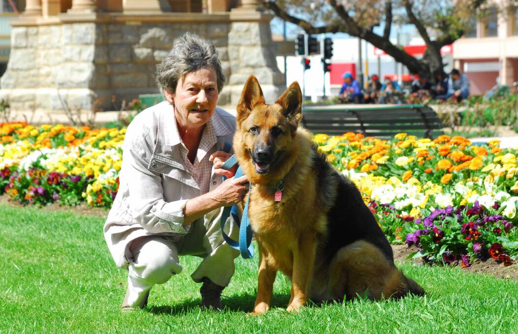 TWO OF US: Kerrie Drew and Rilie will be among the crowd at Sunday’s blessing of the animals at All Saints’ Cathedral. Photo: ZENIO LAPKA 093014zblessing