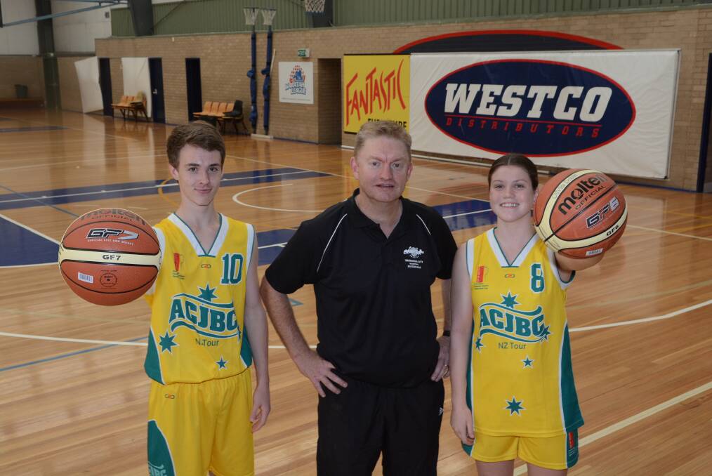 MEDALS ALL ROUND: Paul Masters (centre) coached the under 14s girls Australian Country Cup side to a silver medal in Tauranga, New Zealand. Will Cranston-Lown and his under 16s team-mates also got a silver, while Olivia Doble's under 16s team got a bronze. Photo: PHILL MURRAY 041515pbasket