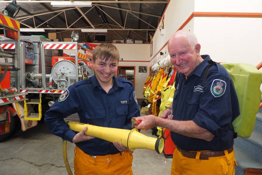 NEW AND OLD: Eglinton Rural Fire Brigade's youngest member Dominic Grabham, 18, and oldest Clinton Bawden, 76, will be among those helping the brigade celebrate its 75th birthday today. Photo: ZENIO LAPKA 120814zrfs