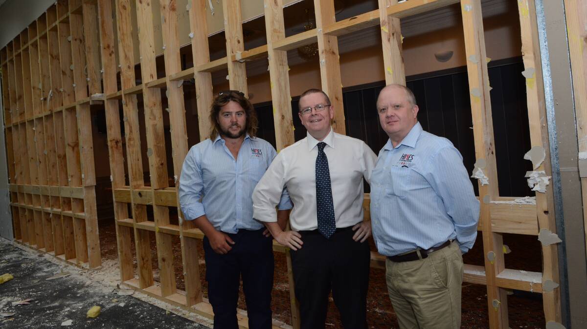 NEW LOOK: Bathurst RSL Club general manager Peter Sargent (centre) with Mark Donnelly and Paddy Barber of Hines Constructions in the main hall of the club which is undergoing renovations. Photo: PHILL MURRAY 012015prsl1