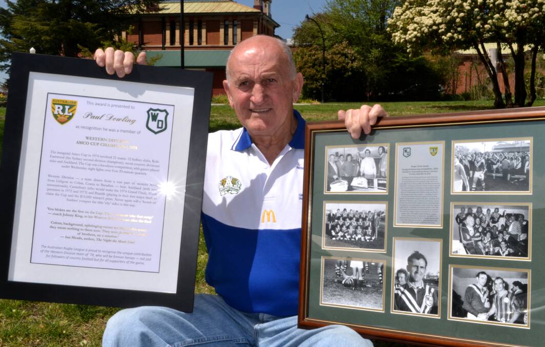 RECOGNITION: Paul Dowling holds his certificate recognising the Western Division 1974 Amco Cup win (left) as well as a framed piece celebrating him as the newly-crowned player of the series. Photo: BRIAN WOOD 093014bwdowling