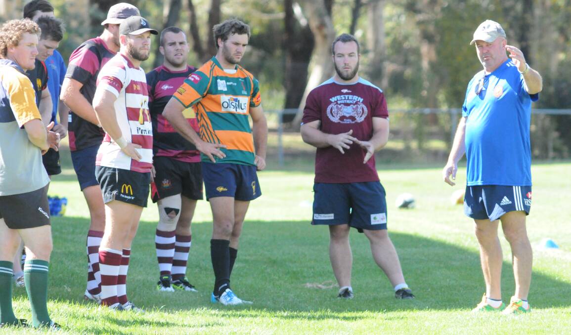 THIS WAY: Steve Hamson (right) directs trafic at Endeavour Oval. Photo: JUDE KEOGH