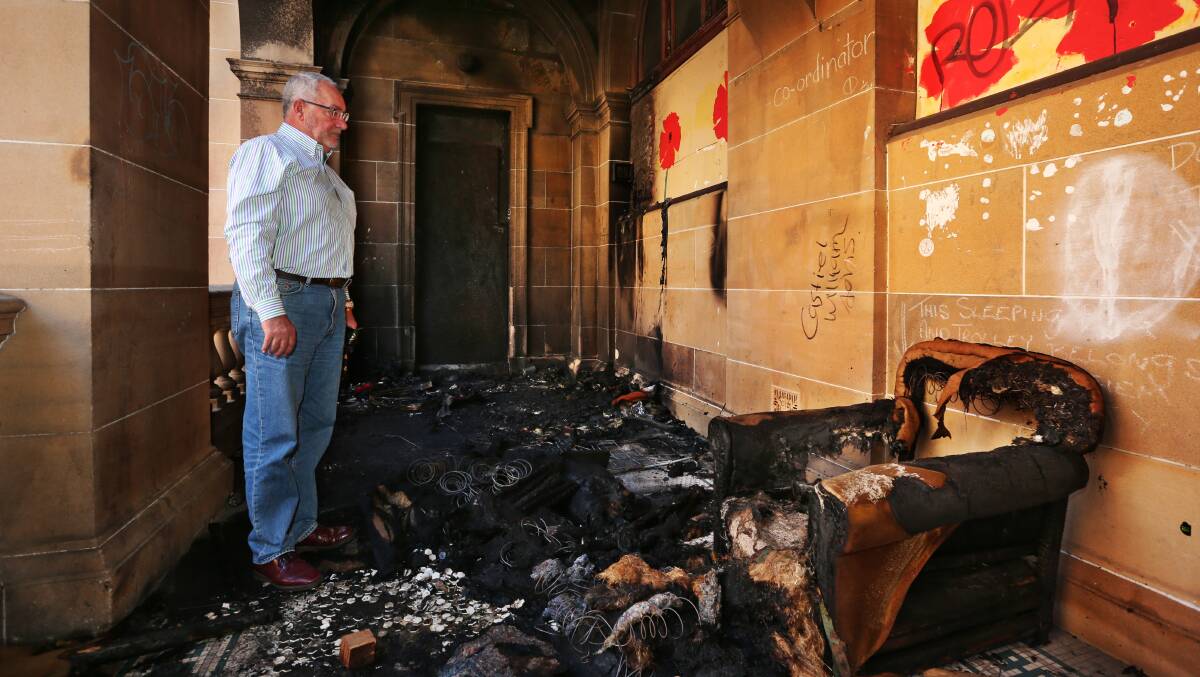 Charred: Awabakal Local Aboriginal Land Council CEO Rob Russell at the old Newcastle post office recently damaged by fire. Picture: Simone De Peak