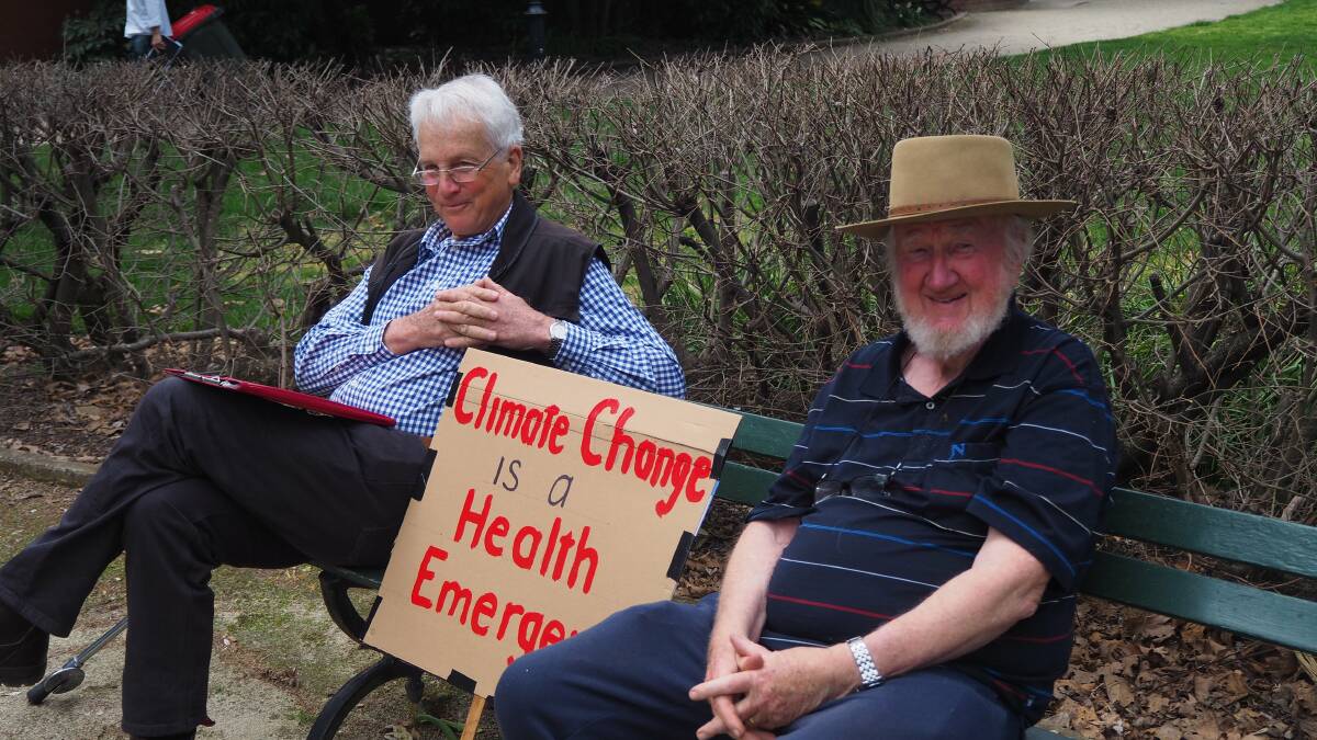 GET TALKING: Charles Sturt University Adjunct Professor David Goldney, pictured on the right with Dr Jim Blackwood at last Friday's Global Climate Strike, has called for a more holistic approach to the climate change debate.