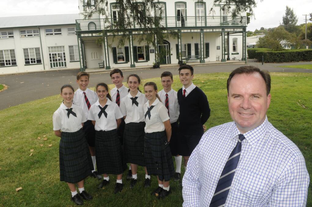 WELL DONE: All Saints' College head Steven O'Connor with students who performed well in NAPLAN testing. Photo: CHRIS SEABROOK 031517cnaplan
