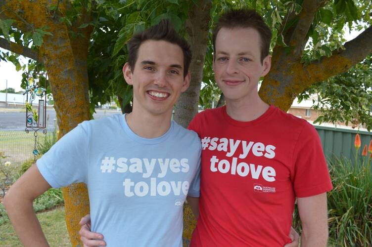 EQUALITY WANTED: Russell Nankervis and Adam Clark say to vote yes in the Marriage Law Postal Survey means "you belong in a world where everyone is loved and equal". Photo: SUPPLIED 101217survey
