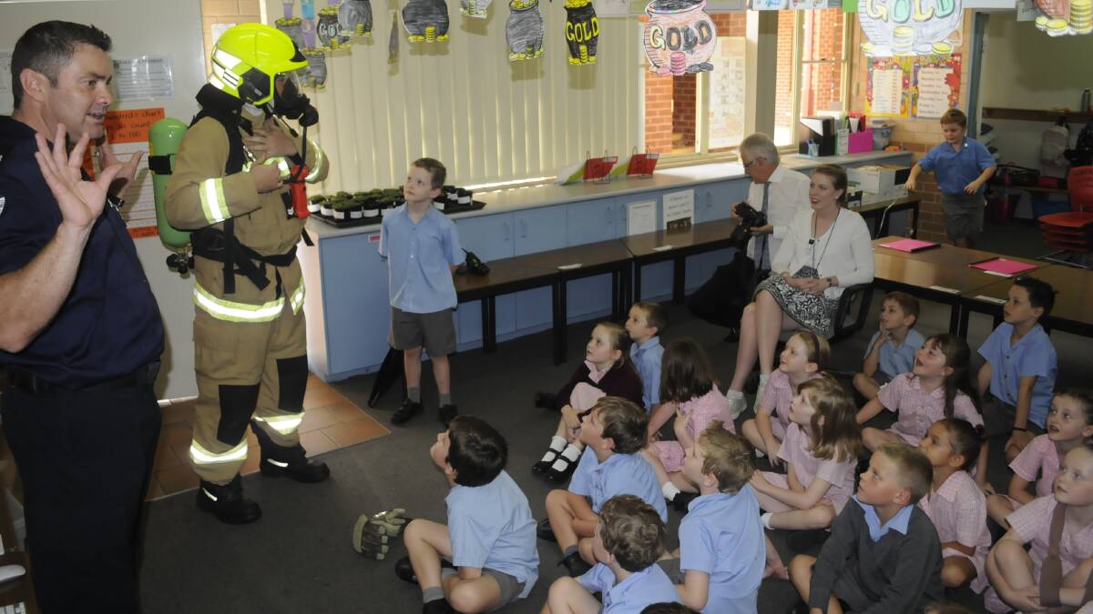 SAFETY FIRST: Bathurst's Fire and Rescue NSW crews during a lesson in fire safety for students at Cathedral School. Photo: CHRIS SEABROOK 032217c