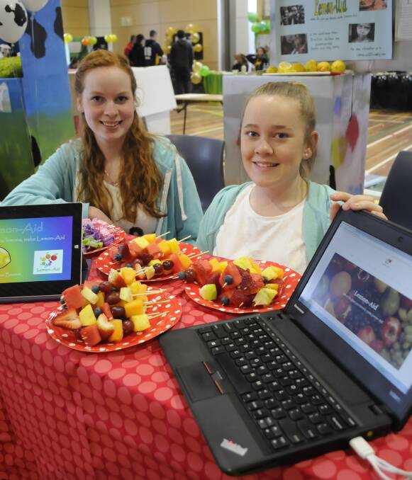 GLOBAL THINKING: Year 10 students Alex Browett and Chloe Caldwell with their Lemon-Aid stand at the Biotech Expo, the duo said their concept could change the world. Photo: CHRIS SEABROOK 092016cexpo1