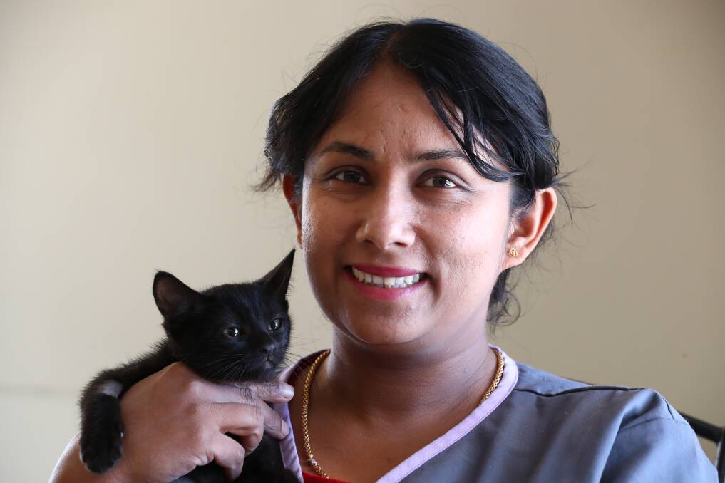 WELCOME: Bathurst Vet Hospital's new veterinarian Dr Kumari Wathulande with Jet the cat. Photo: PHIL BLATCH 020518pbvet1