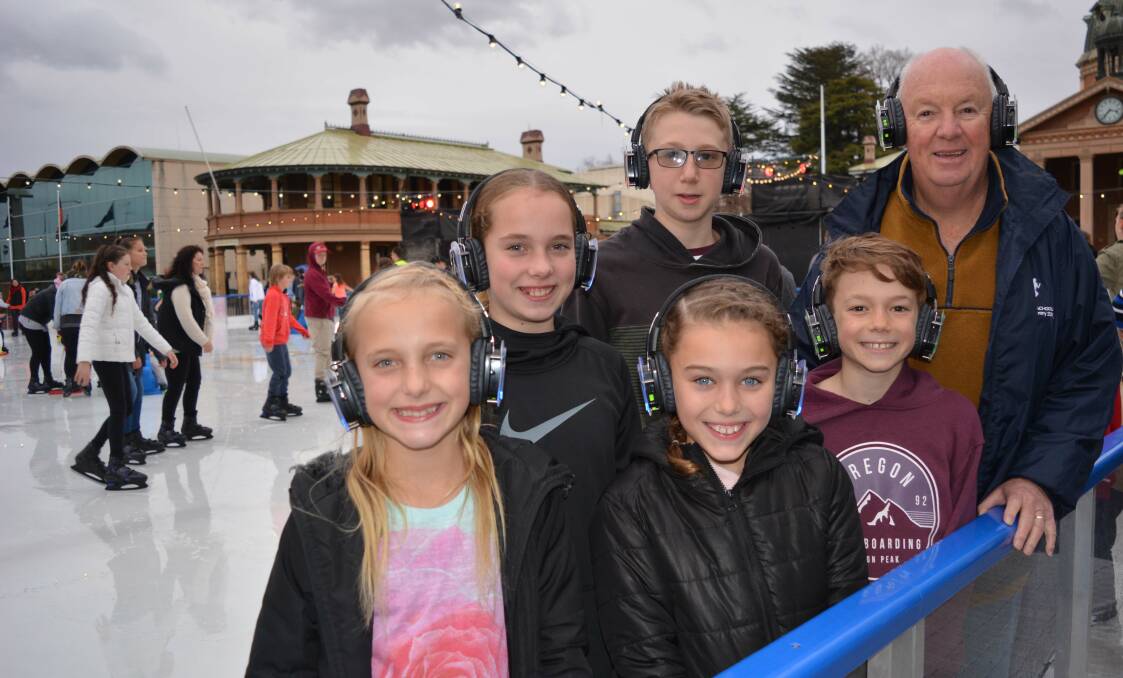 DISCO READY: Bathurst Regional Council mayor Graeme Hanger with his grandchildren (back) Lexie, William (front) Ava, Stella and Jake trying out the silent disco headphones. Photo: SUPPLIED 071417disco2