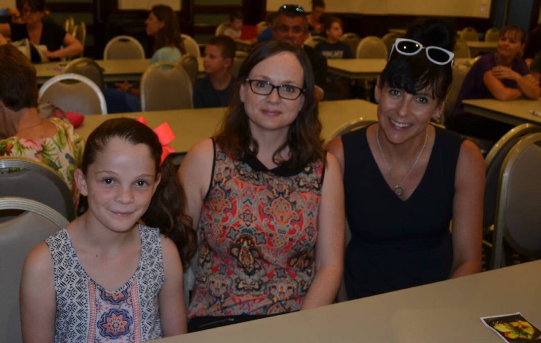 ACTION-PACKED: Sophia, 10, her mother Caroline Pezzuto and Angela Robertson had seats near the front to watch the action. 012017nmshow8