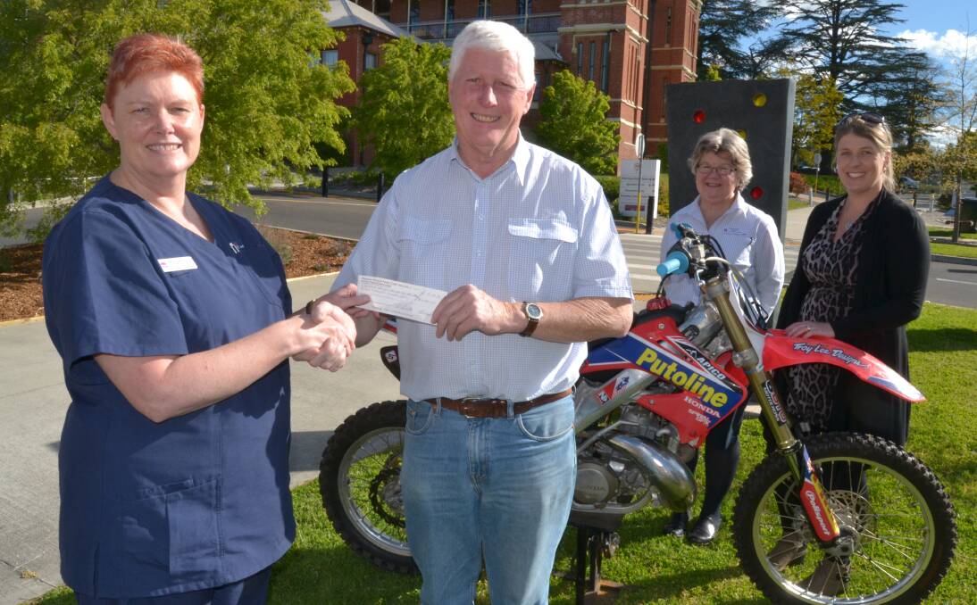 IN MEMORY: Bathurst Hospital ICU's Anne Morrison, Panorama Motorcycle Club's Bruce Morgan, acting director of nursing and midwifery Patsy Sullivan and Susan Hurt (mother of Jake Carroll). Photo: NADINE MORTON 102016nmbike1