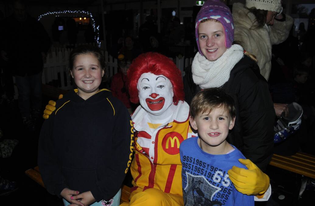 HELLO THERE: Ronald McDonald with Kalari, 11, Taylah, 12, and Jye, 8, Wade at the Bathurst Winter Festival.