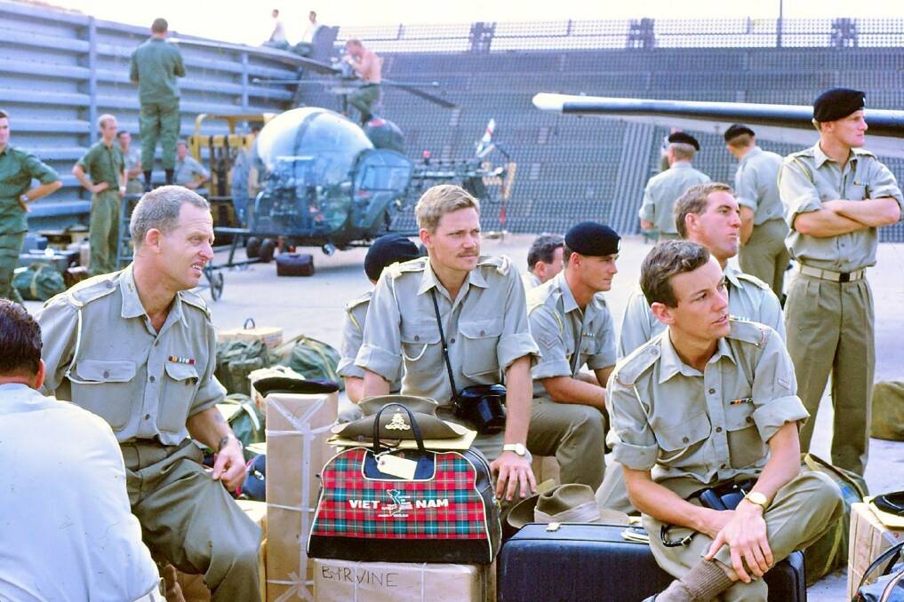 READY TO LEAVE: Bruce Irvine (seated, front right) just before he flew out of Vietnam on February 20, 1968 after his nine-month deployment for the war effort. Photo: SUPPLIED 022118vietnam1