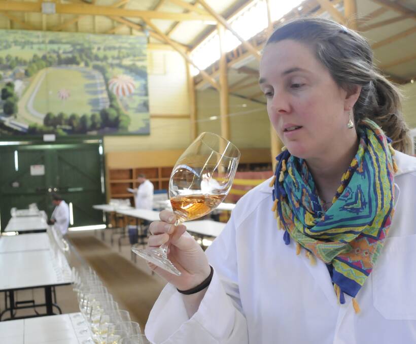 TOP TASTE: Tasmanian Greer Carland was invited to judge more than 800 wines at this year's National Cool Climate Wine Show in Bathurst. Photo: CHRIS SEABROOK 102516cwine1