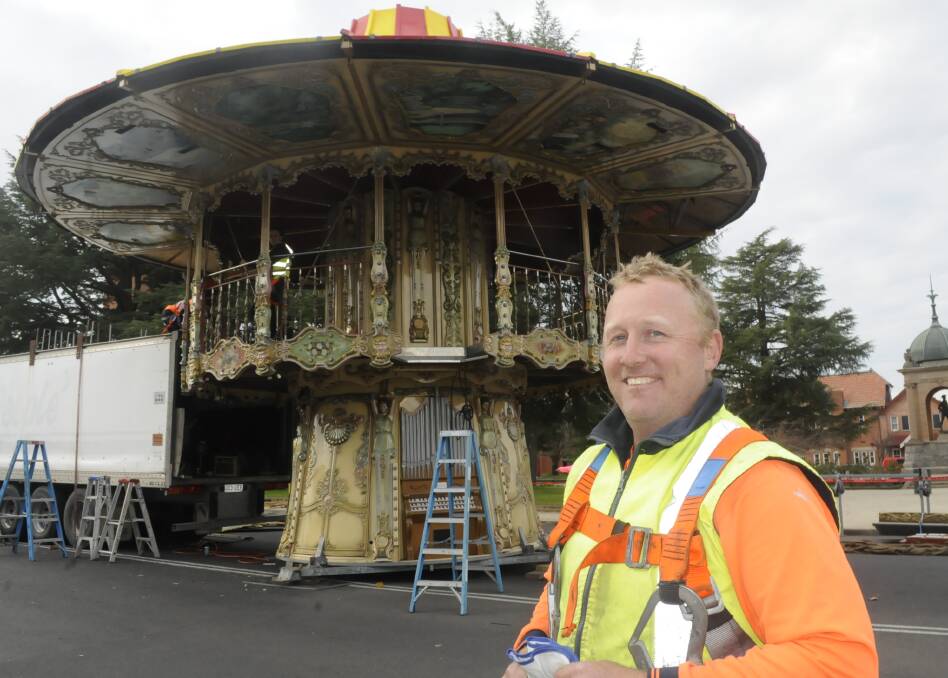 ALMOST READY: Owner Josh Evans has been part of a team of people putting together an Italian made two storey carousel on Russell Street in preparation for the Bathurst Winter Festival. Photo: CHRIS SEABROOK 062716carasel1