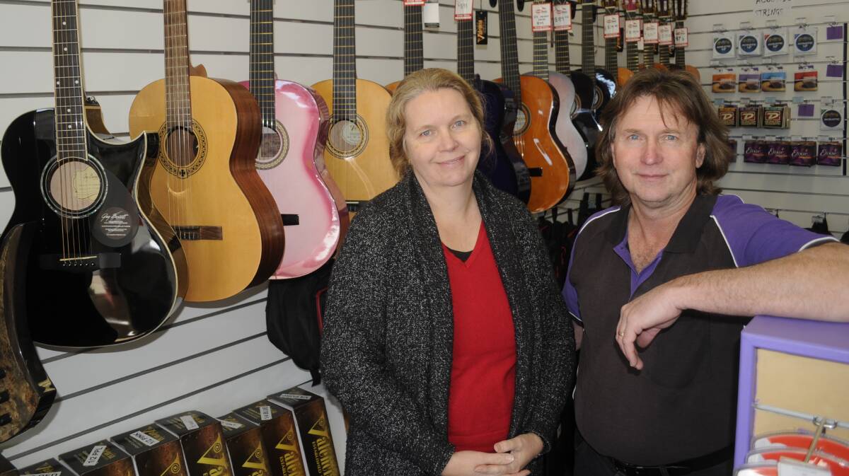 END OF AN ERA: Harmonikos owners Cath and Phil Snitch say it was a difficult decision to close their business after 12 years and they have thanked the community and students for their support. Photo: CHRIS SEABROOK 080217close1