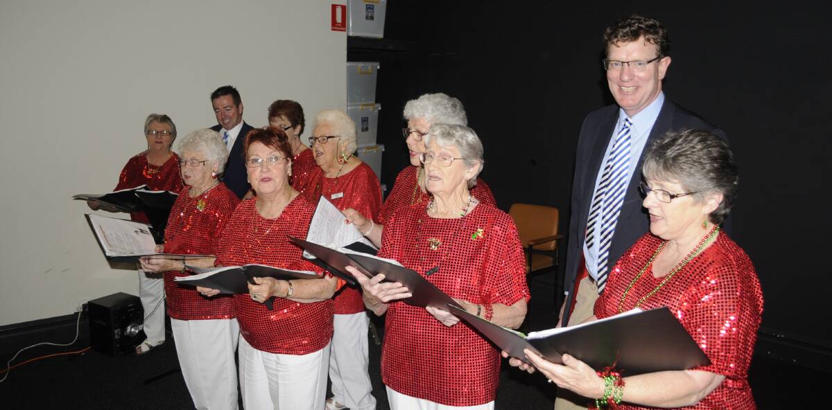 SNAPSHOT: MPs Paul Toole and Andrew Gee lent their tonsils to the Seymour Centre's annual Christmas carols. Photo: CHRIS SEABROOK 120616seymr10