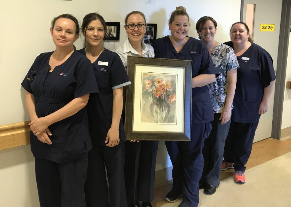 GRATEFUL: Bathurst Hospital staff Renae Grant, Diana Cossu, Catherine Poschich, Rachel Oakes, Rachel Campisi and Tara Lewis with the donated painting. 101917art