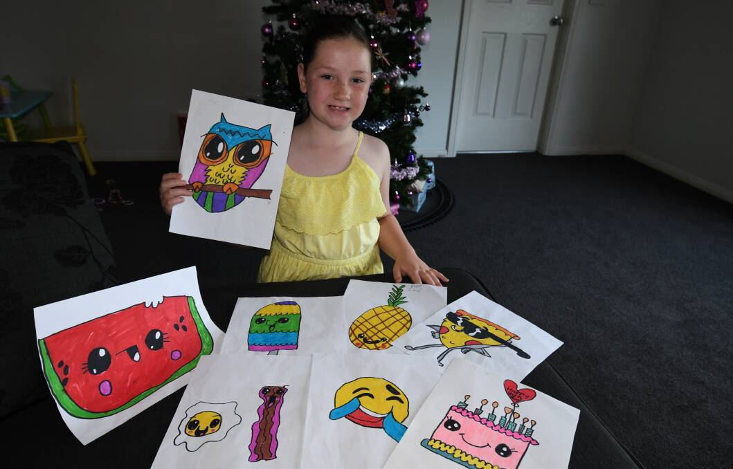 CREATIVE TYPE: Maddison Gorrell, 7, has put her creativity to the test to help the community this Christmas. Photo: CHRIS SEABROOK 121817cdrawn1