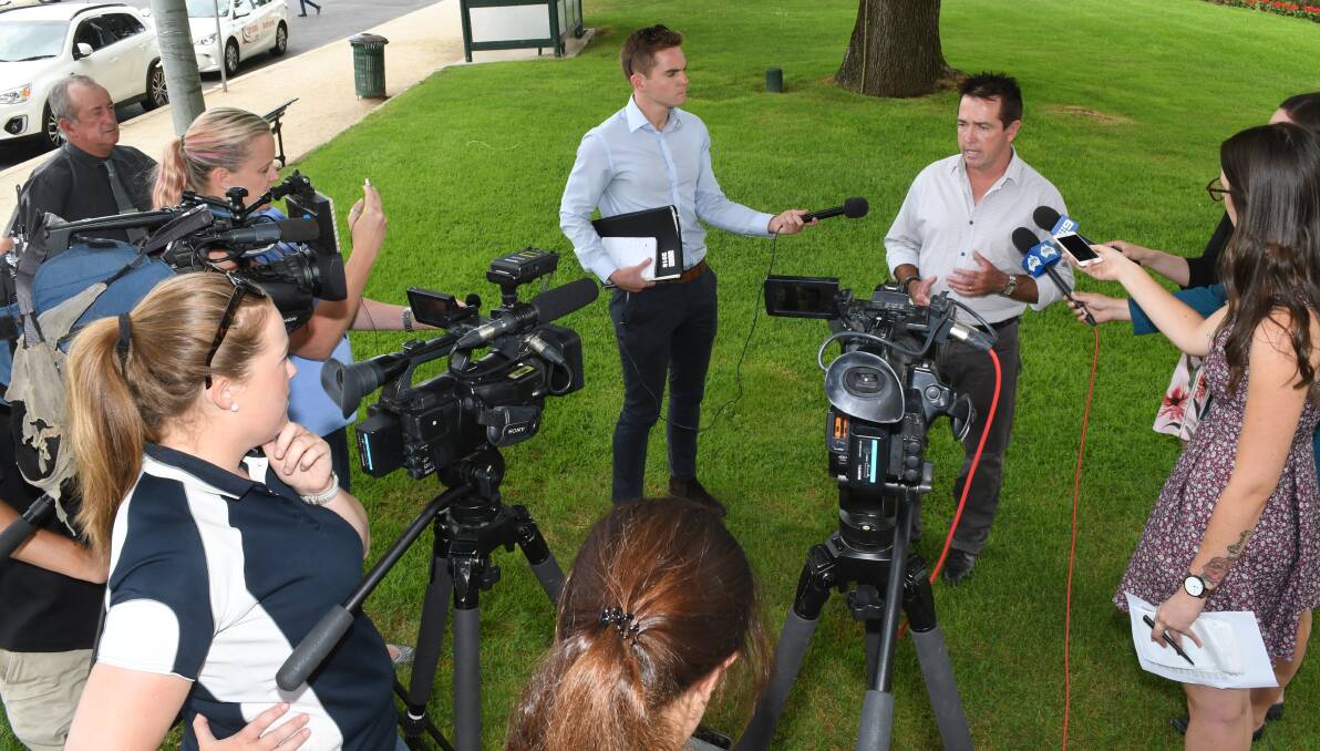 MEDIA SCRUM: Print, radio and television media were out in force to hear local Member for Bathurst Paul Toole announce major funding for an upgrade of the Colo Road. Photo: CHRIS SEABROOK 010818colo3