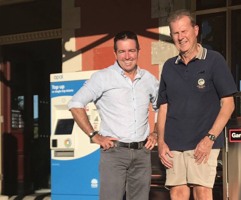 ADDITION: Member for Bathurst Paul Toole and Rail Action Bathurst chair John Hollis with the Opal top up machine at Bathurst Railway Station. Photo: SUPPLIED 022017opal